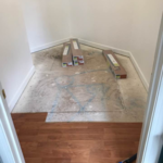 Closet before shelves and wood floor