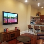 TV installation with electrical outlet on top
