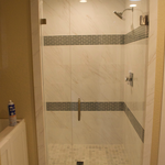Inline frameless shower door