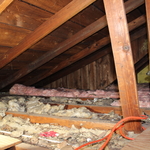 Before: Deteriorated fiberglass insulation