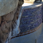 Calcium buildup on tile and stone at waterline.