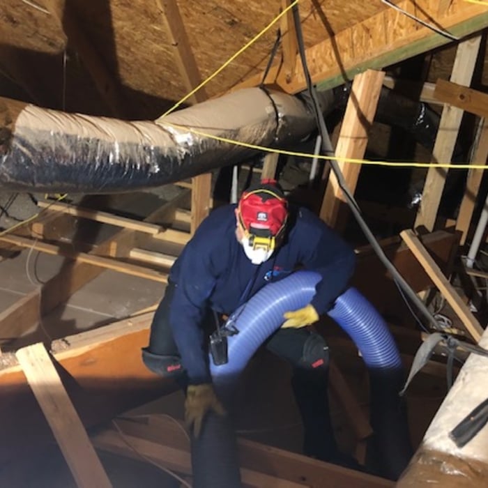 One of our owners blowing in insulation.