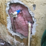 repaired stucco around hose bib