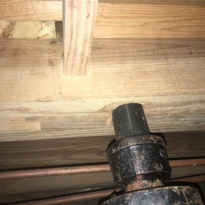 Plumbing Pipe Hole in Floor Joists
