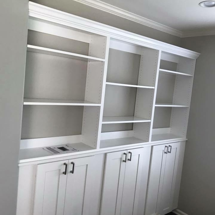 book shelf with low cabinets for storage