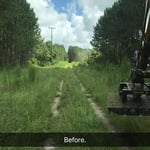 Excavator mowing.