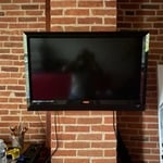 T.v mounted Exposed Brick