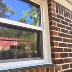 New window with custom exterior trim in brick