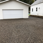 Driveway cleanup and new gravel compacted