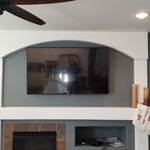65" TV Above the Fire place.