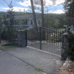 INSTALLATION OF STEEL DUAL SWING DRIVEWAY GATE