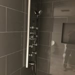 Shower with body sprays and hand held sprayer