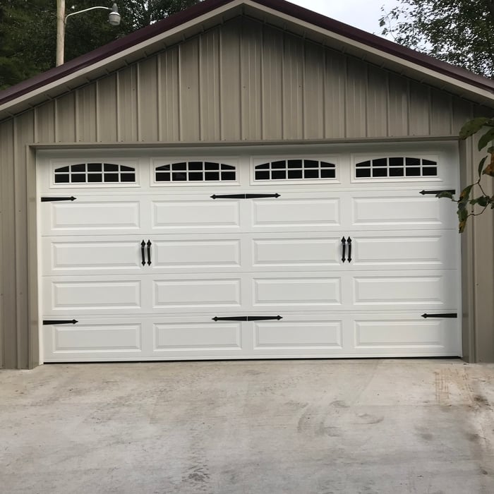 Beautiful carrige style door with decorative Hardw