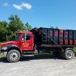 Freightliner with 20 yd dumpster