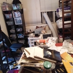 Craft supplies piled on the bed