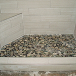 Pebble shower floor with Shluter drain