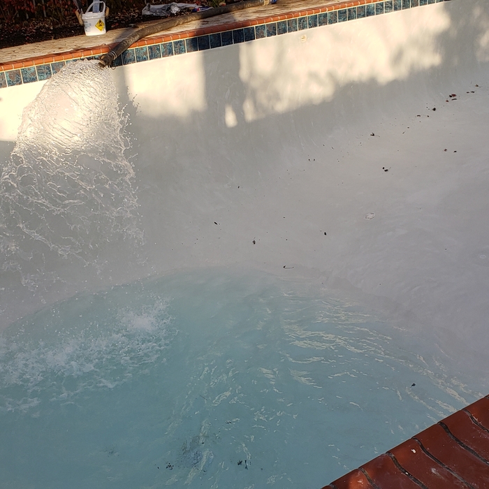 Filling a re-plastered pool.