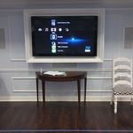Television with molding and in-wall speakers