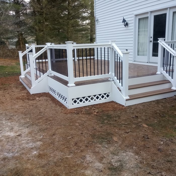 Picture frame composite deck with 2 sets of steps.