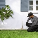 Technician inspecting foundation