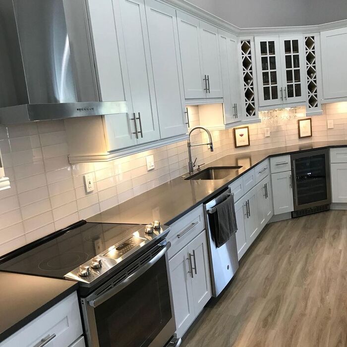 Black Stone with White Cabinets