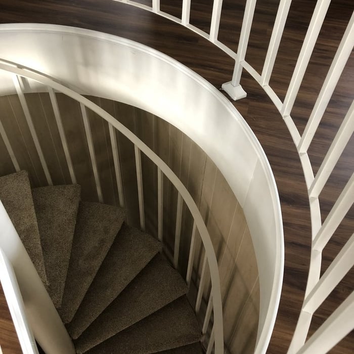 Vinyl and carpet finish for spiral stairs