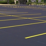sealed asphalt parking lot with restripe