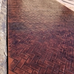 Stamped red brick color concrete patio pad