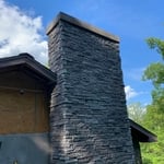 Outside stone chimney with 8” concrete cap