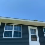 Royal Blue siding with white soffit and facia