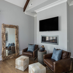 Leather Chairs with accented Cowhide Ottomans