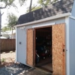 Install gutters on homeowner's shed