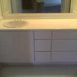 cabinet with drawers and corian countertop