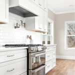 White hood, bevelled tile backsplash