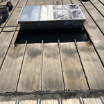 TPO curb flashing on metal roof.
