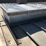 TPO curb flashing on a metal roof.