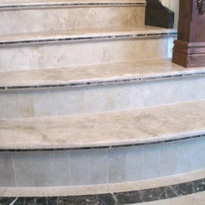 custom tile stairway with custom tread inlay