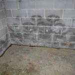 Water stains along basement wall
