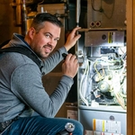 Gary of Due North inspecting a furnace