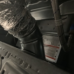 dryer vent and hoses at the machine