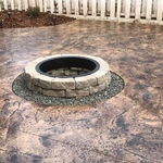 Stained and Stamped Patio Surrounding Fire Pit