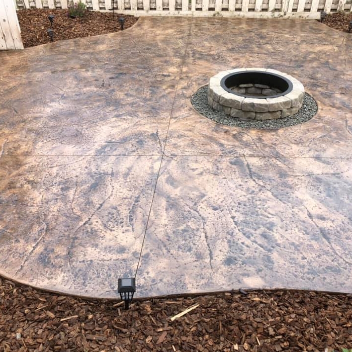 Stained and Stamped Patio Surrounding Fire Pit