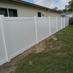 T&G WHITE VINYL FENCE.