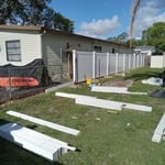T&G WHITE VINYL FENCE.