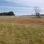 Customer's yard after debris removal, and grad
