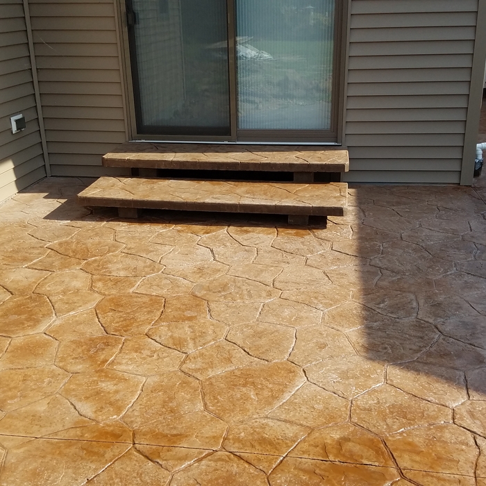 Stamped patio with separate poured step