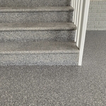 Coated wood steps from garage to house