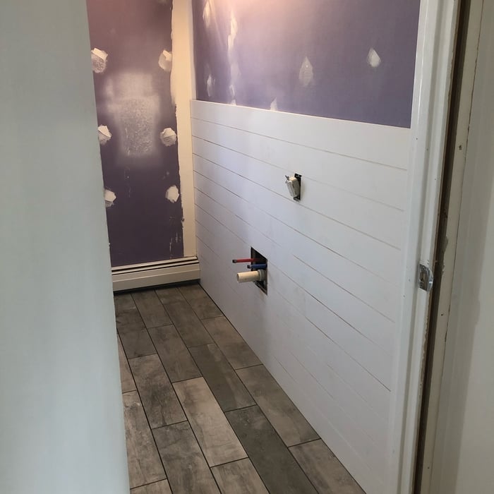 Tile floor and shiplap walls