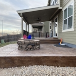 Deck into stamped conrete pad incorporation.