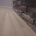 Install detail under stone fireplace